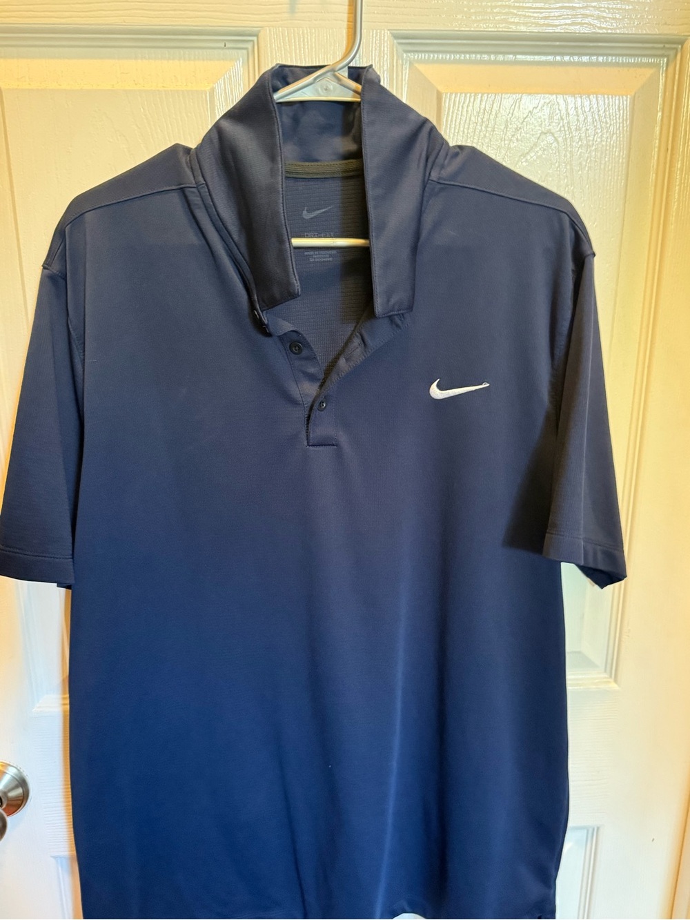 Nike Men's Navy Blue Polo with White Swoosh